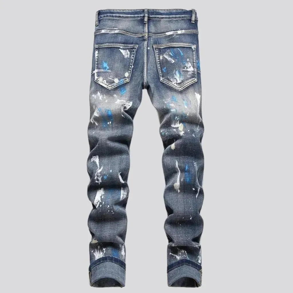 Medium-wash men's painted jeans