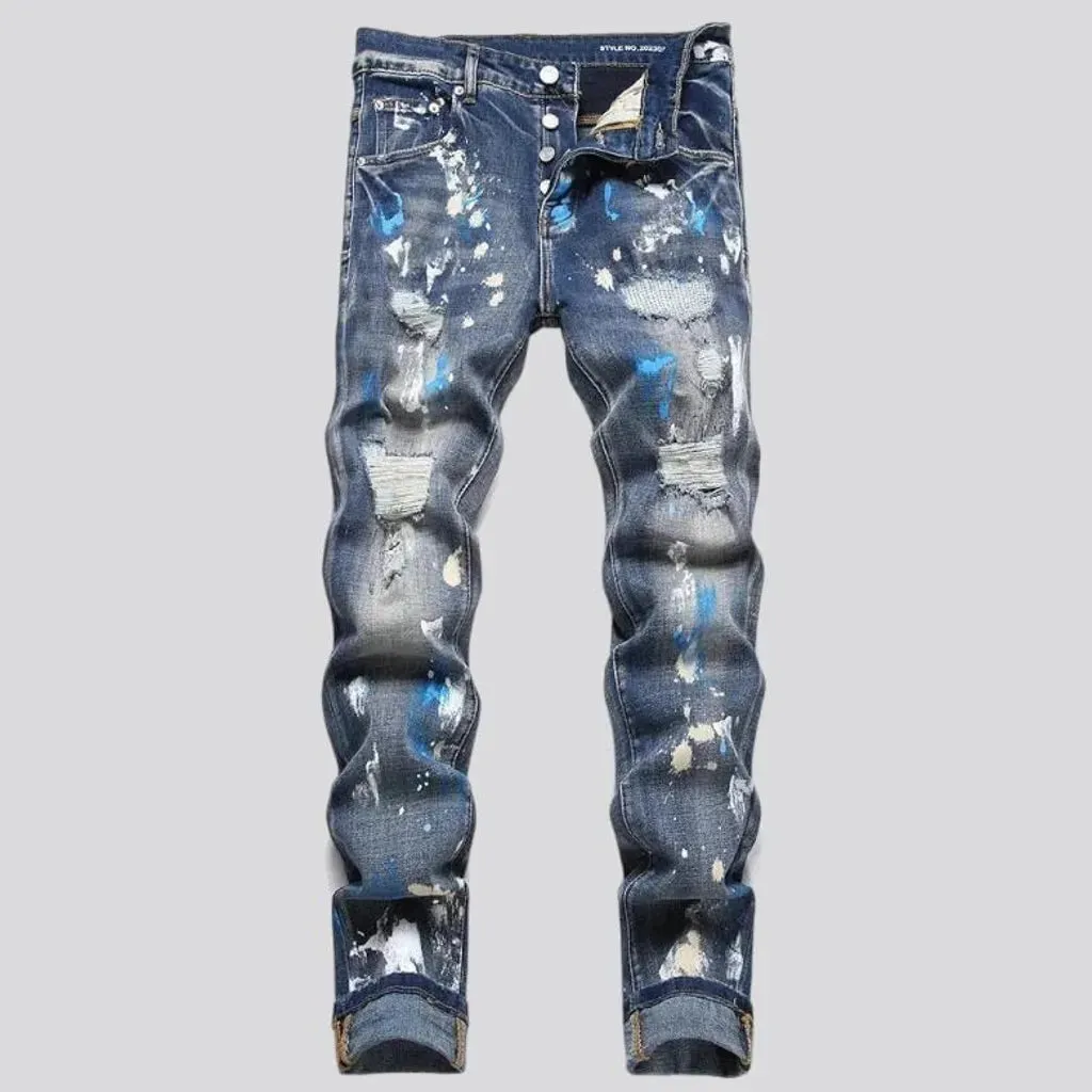 Medium-wash men's painted jeans